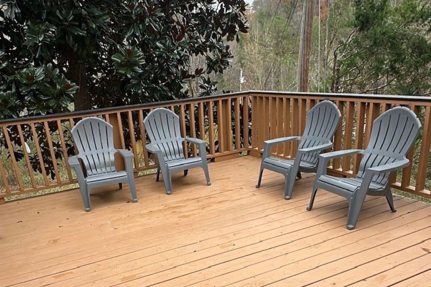 Exterior seating area adjacent to hot tub an grill
