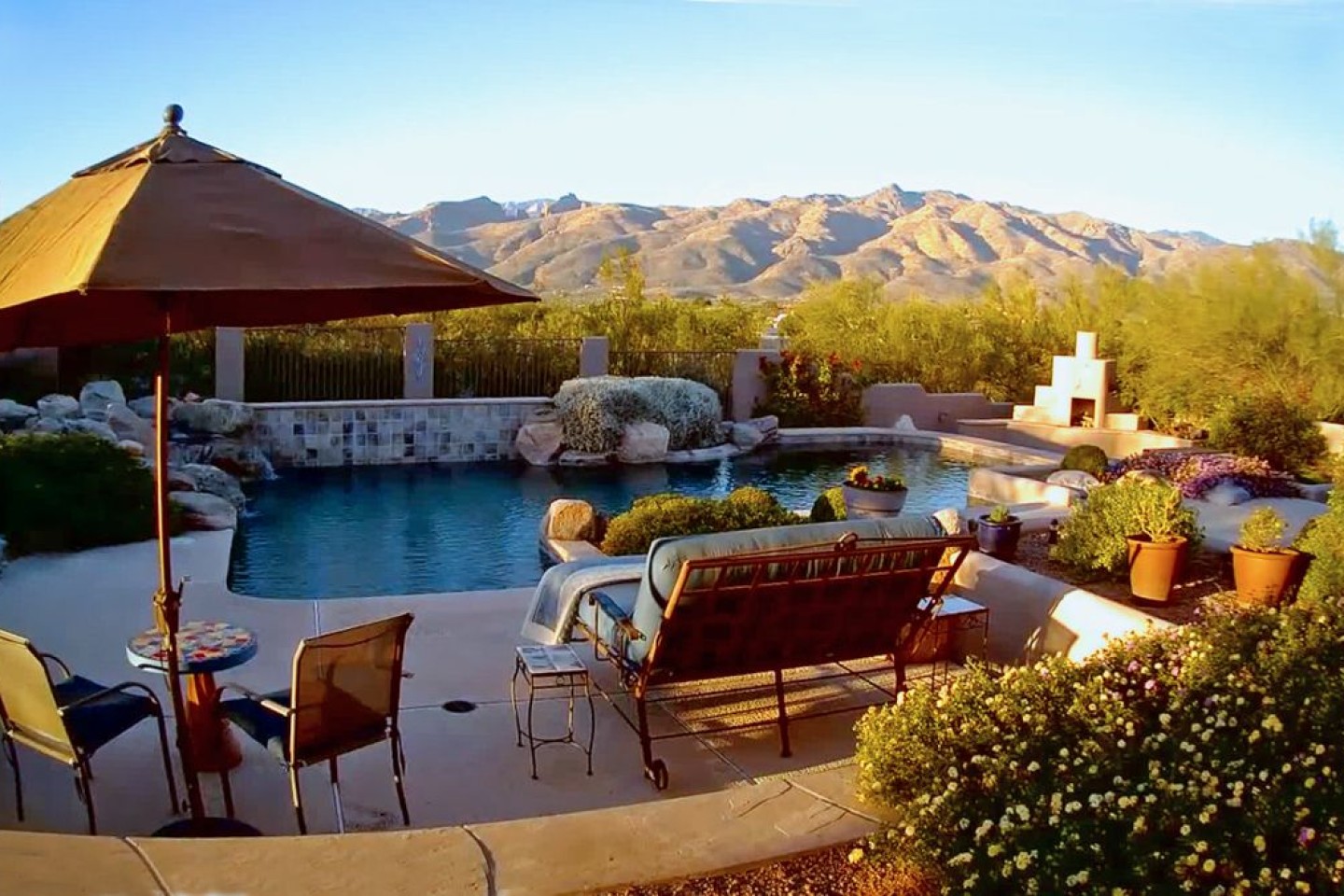 Relax by the pool as you watch shadows move across the mountains.